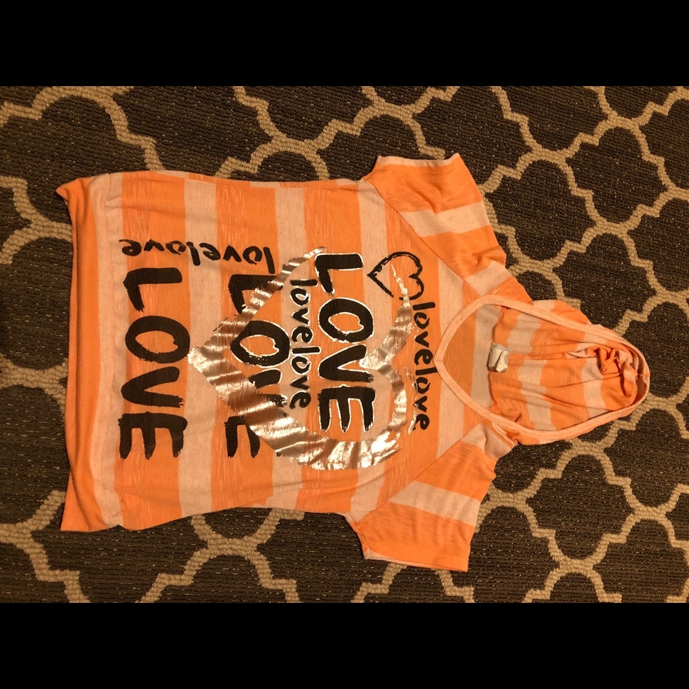 Children’s peach colored tee shirt that says love